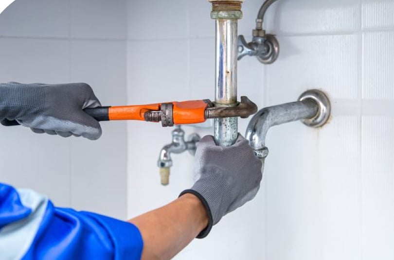 Plumber Tightening Pipe — Expert Trade Services in Burleigh Heads, QLD
