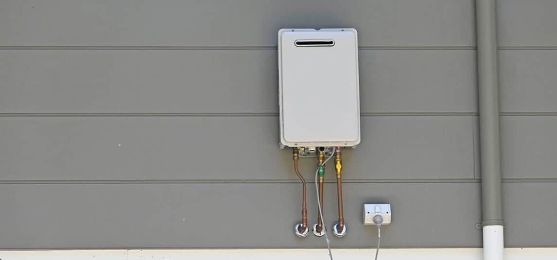 Instanteneous Gas Hot Water Heater On The Side Of A House — Expert Trade Services in Burleigh Heads, QLD