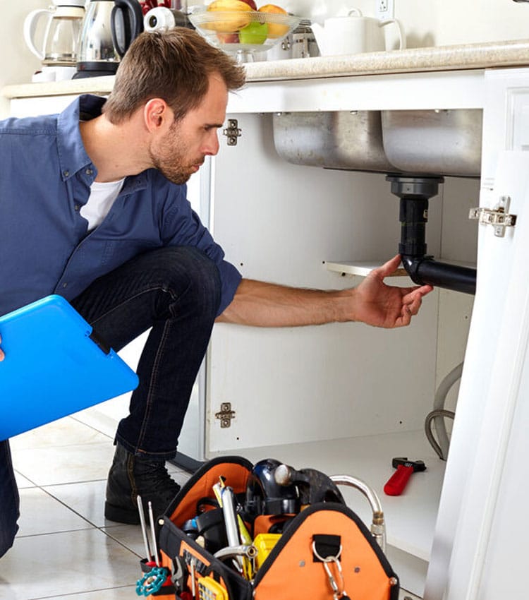 Plumber Checking Kitchen — Expert Trade Services in Burleigh Heads, QLD