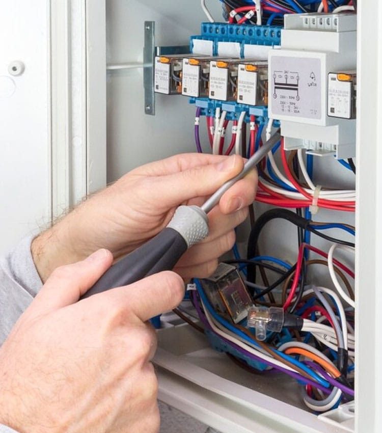 Electrician At Work On A Electrical Panel — Expert Trade Services in Burleigh Heads, QLD