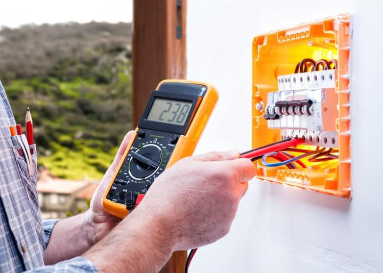 Electrician Technician Checking Residential Electrical Panel — Expert Trade Services in Burleigh Heads, QLD