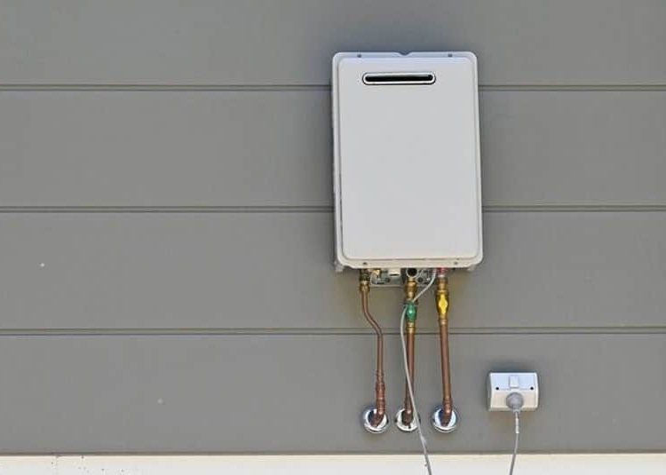 Instanteneous Gas Hot Water Heater On The Side Of A House — Expert Trade Services in Burleigh Heads, QLD