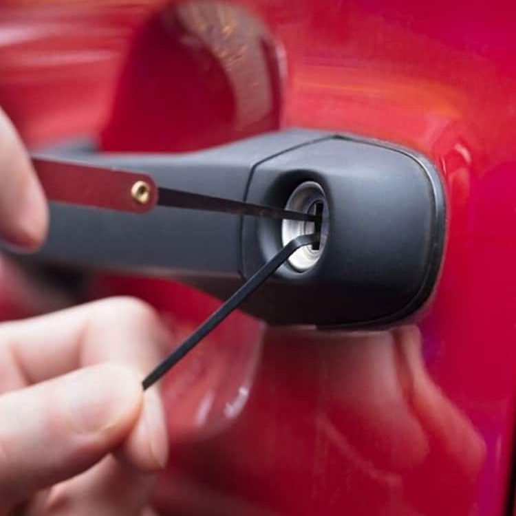 Opening Red Car's Door With Lockpicker — Expert Trade Services in Burleigh Heads, QLD