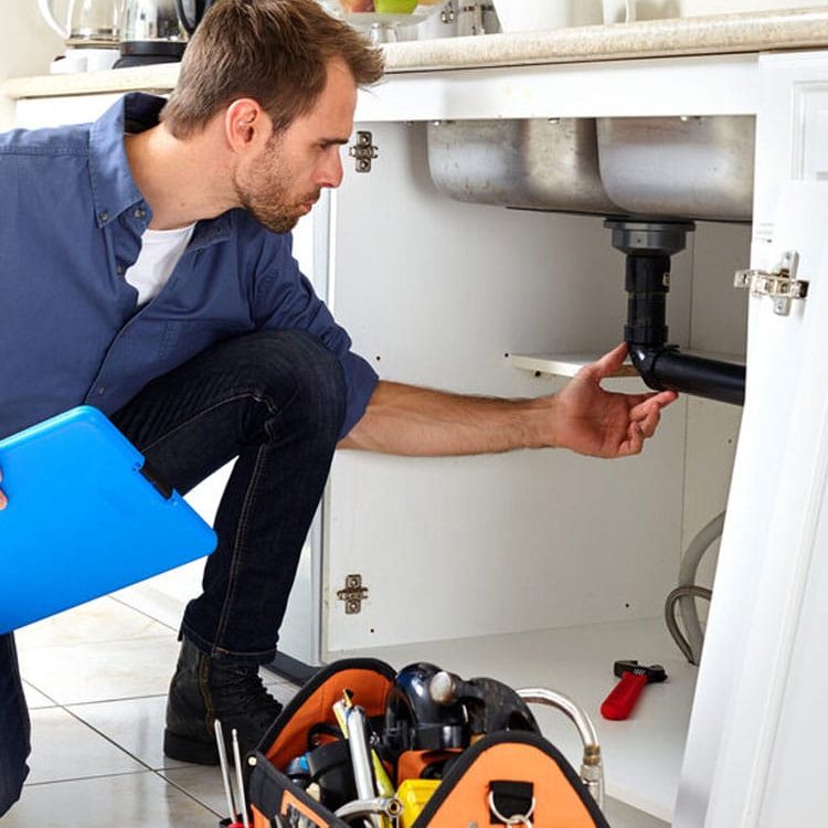 Plumber Checking Kitchen — Expert Trade Services in Burleigh Heads, QLD