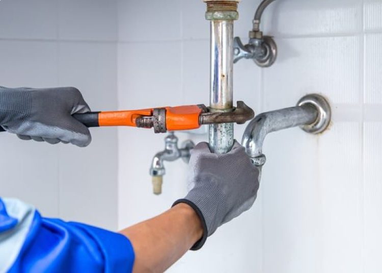 Plumber Tightening Pipe — Expert Trade Services in Burleigh Heads, QLD