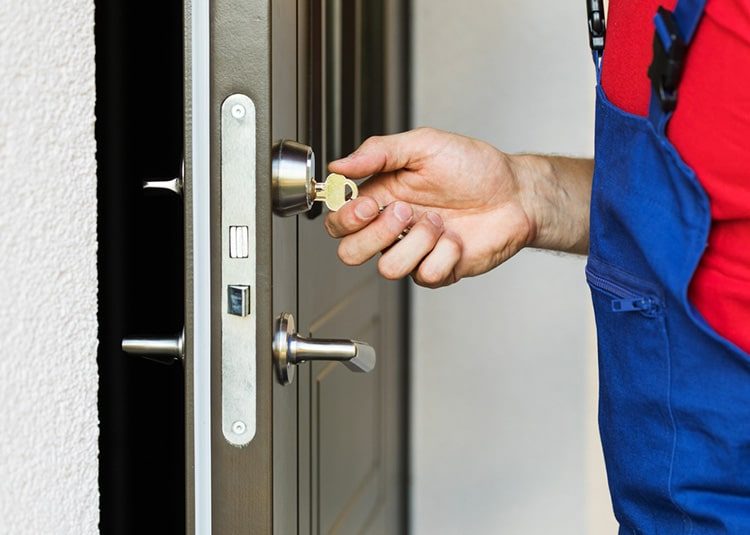 Repairman Working with House Door Lock — Expert Trade Services in Burleigh Heads, QLD